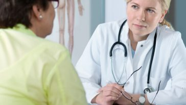 female doctor in discussion with older female patient
