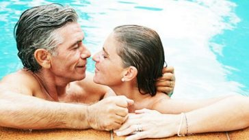 older couple kissing in pool