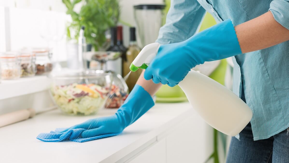woman cleaning kitchen