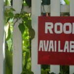 sign on white picket fence reading room available