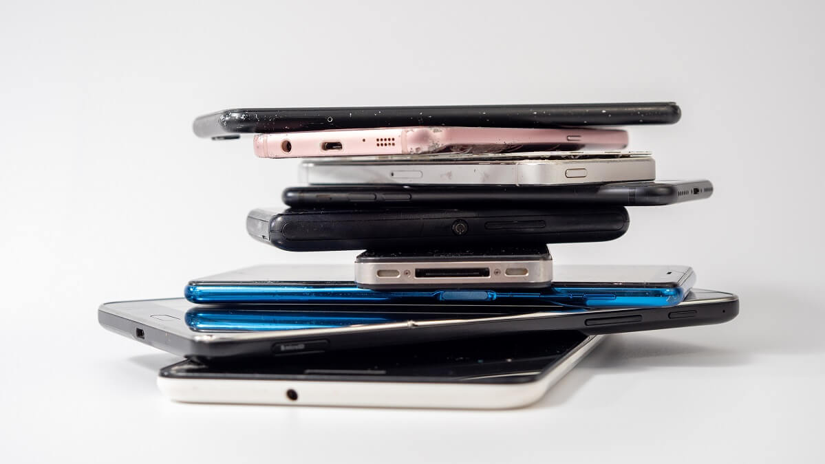 stack of old phones and tablets