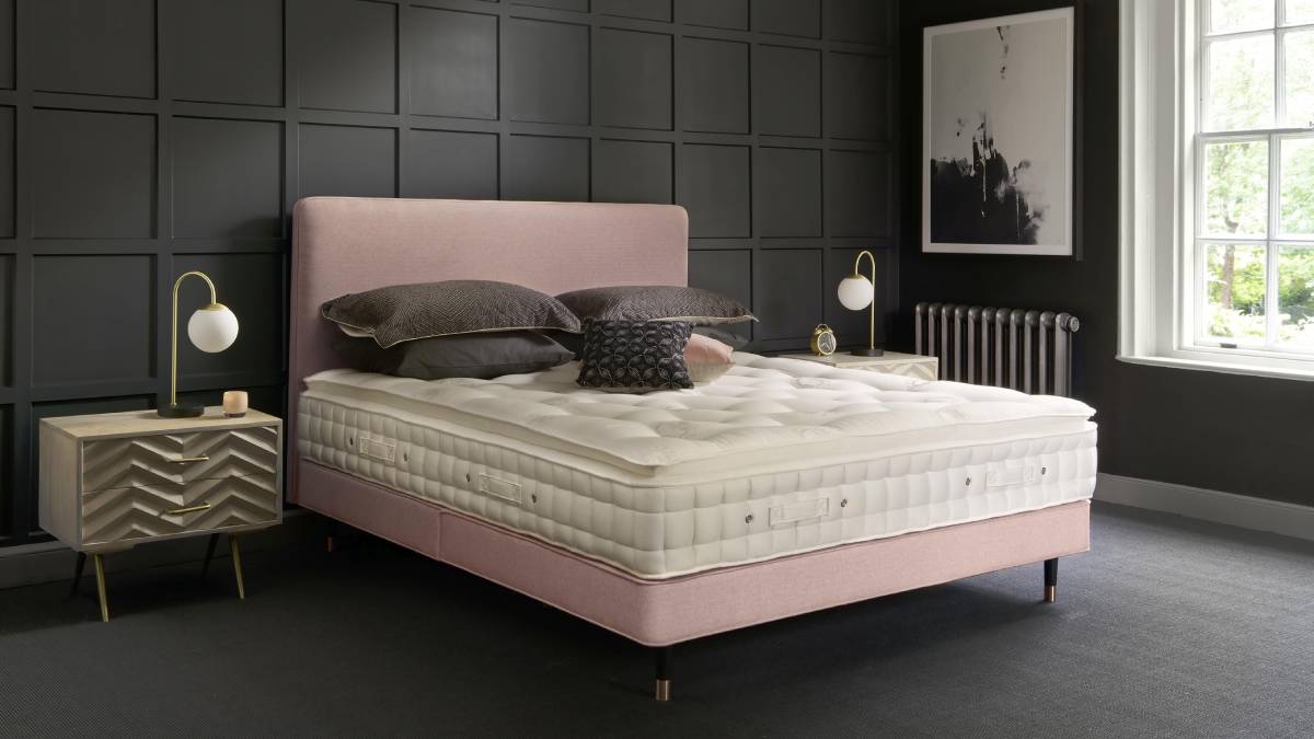 Mattress on a pink bed frame