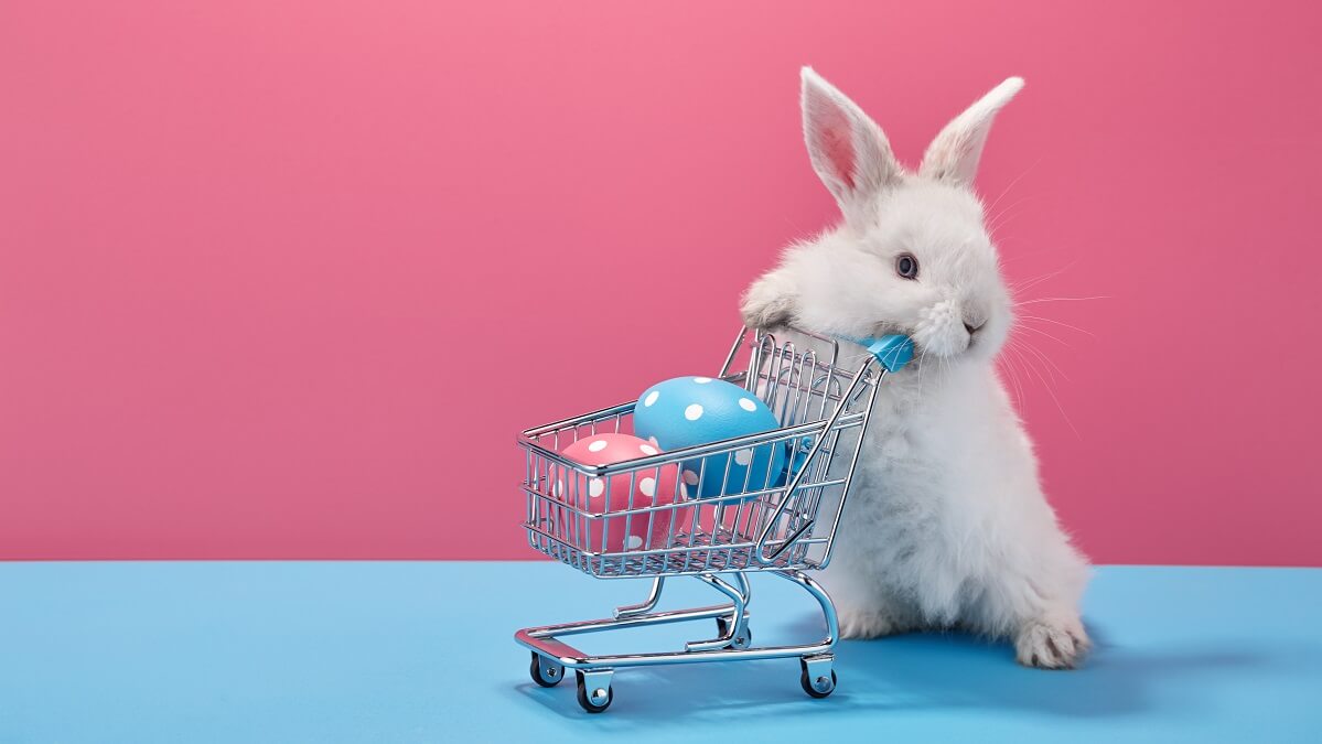 easter bunny pushing eggs in trolley