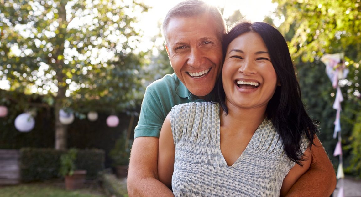 Loving Australian couple in their backyard | Health Insurance Comparison