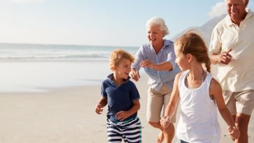 grandparents-and-grandchildren-on-beach