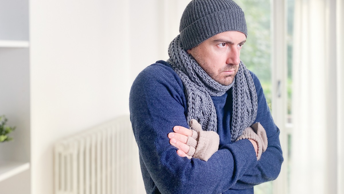 man shivering from cold