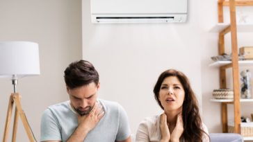 couple struggling with air con
