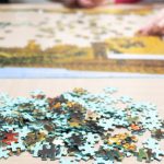 family doing jigsaw puzzle