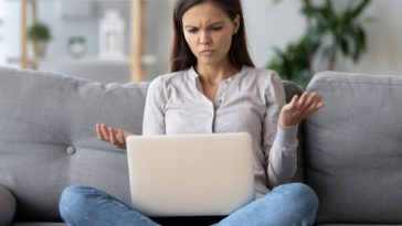 woman frowning at laptop