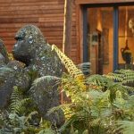 gorilla statues outside cabin