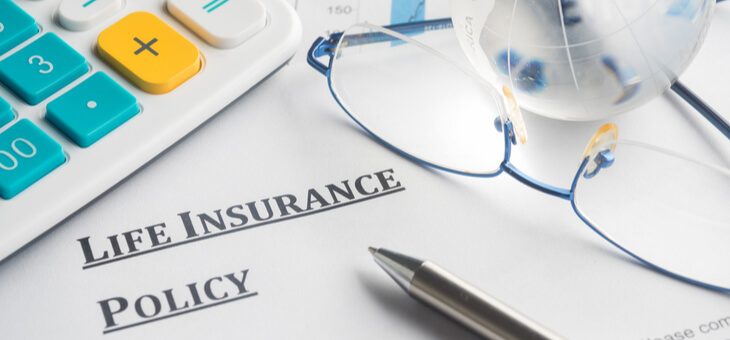 life-insurance-policy on table