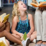 children reading on the floor in class