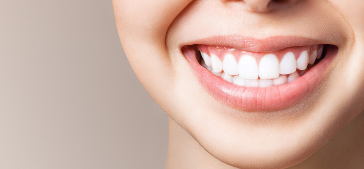 woman's smiling mouth showing white teeth