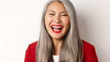 smiling older woman with long grey hair