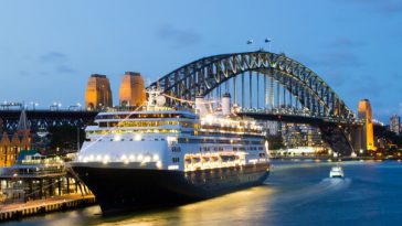 cruise ship docked in sydney harbour at night