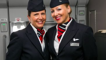 two smiling female flight attendants