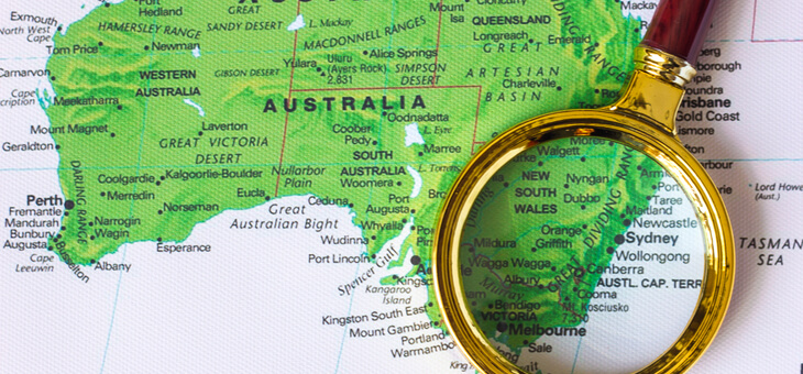 map of australia with magnifying glass resting on top