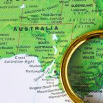 map of australia with magnifying glass resting on top