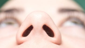 view from underneath woman's nose