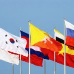 flags of various nations on flagpoles