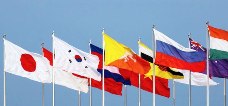 flags of various nations on flagpoles
