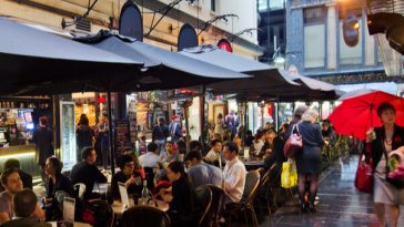 diners eating at outdoor cafes in degraves street melbourne