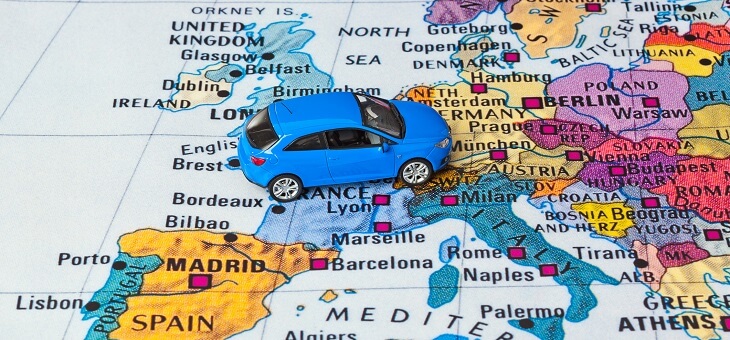 toy car sitting on map of europe