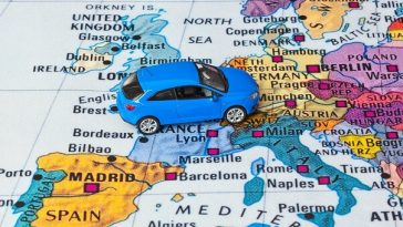 toy car sitting on map of europe