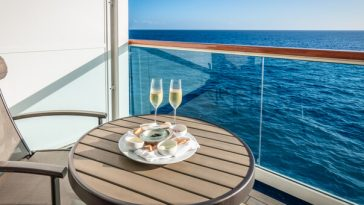 champagne and seafood dinner laid out on table on cruise ship