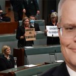 scott morrison with a smarmy look on his face while politicians in the background hold up enough is enough signs in parliament