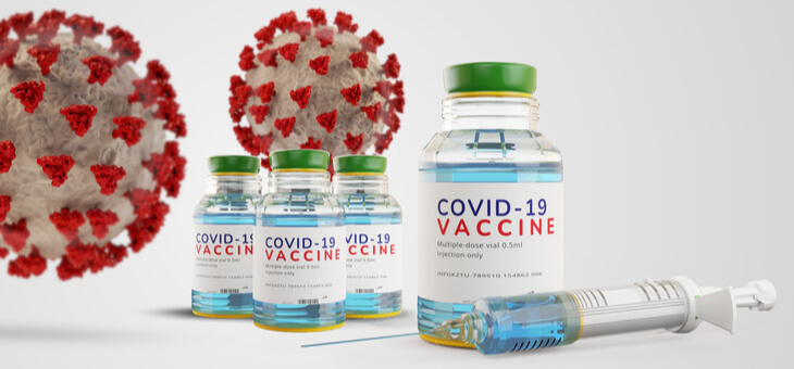 vials of covid 19 vaccine with syringe