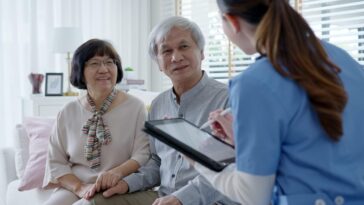 older couple discussing care plan with doctor