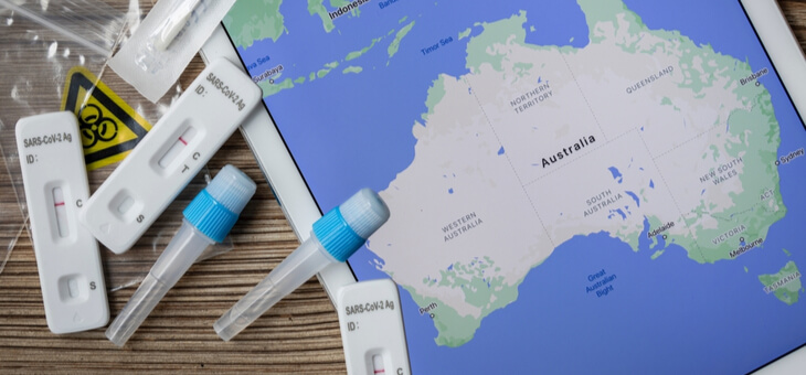 covid rapid antigen tests next to map of australia