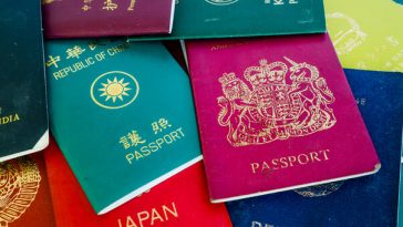 stack of passports from various countries