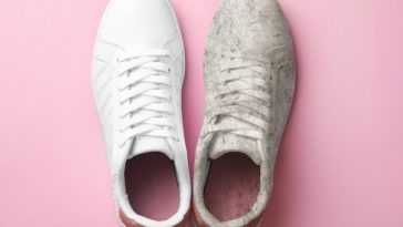 one clean and one dirty white sneaker on pink background