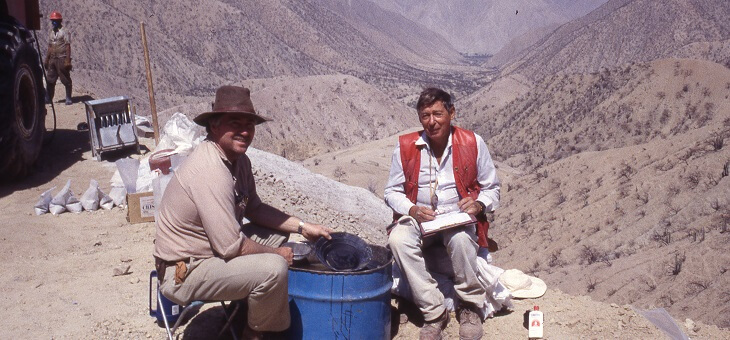 two men sitting at camp in peruvian mountains