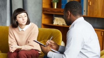 woman in office speaking with therapist