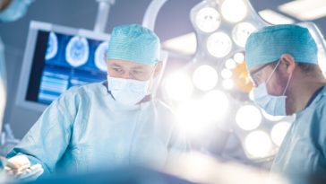 surgeons performing operation in theatre