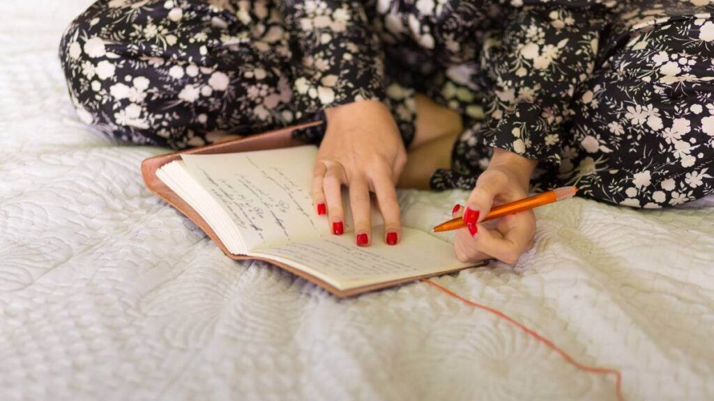 Woman writing a journal