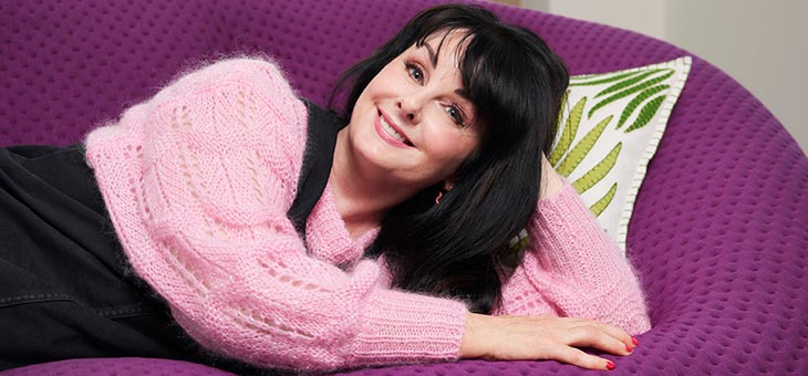 marian keyes on a purple couch