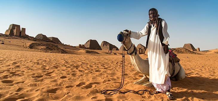 sudanese man with camel