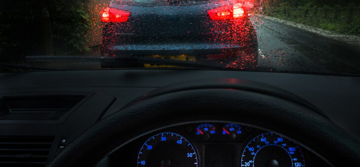 view from driver's seat in car of rear lights of car in front