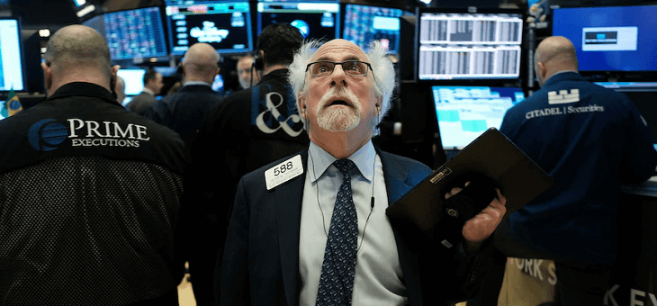stock broker on floor of new york stock exchange