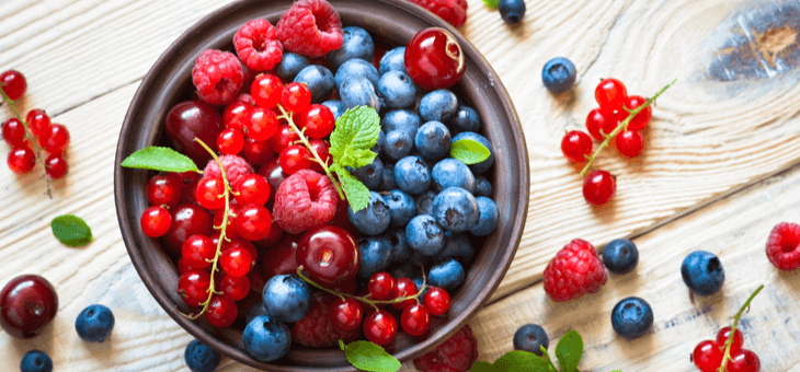 bowl of fresh raspberries, blueberries and cranberries