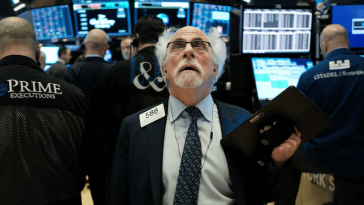stock broker on floor of new york stock exchange