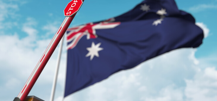 australian flag on flag pole with open boom gate in foreground