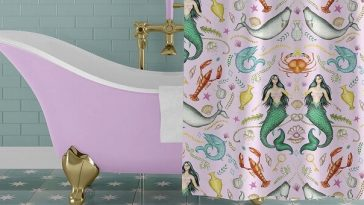 pink clawfoot bathtub with gold feet and mermaid print shower curtain