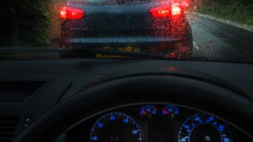 view from driver's seat in car of rear lights of car in front