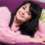 marian keyes on a purple couch