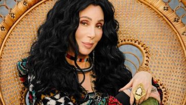 cher reclining in chair